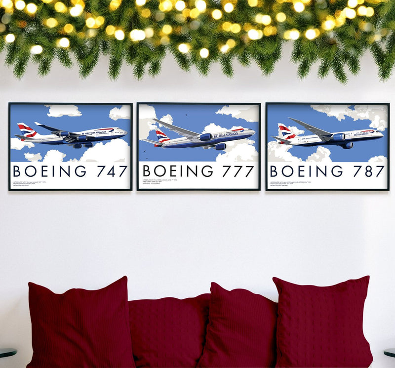 Set of three framed Boeing prints, 747, 777 and 787, above a sofa with red cushions