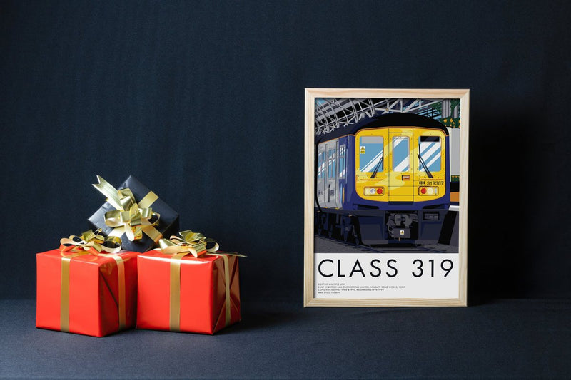 Framed Class 319 print beside red and gold wrapped presents