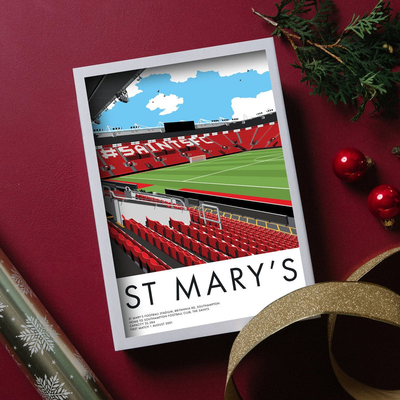 St Mary's stadium print on a red background with baubles and gold ribbon